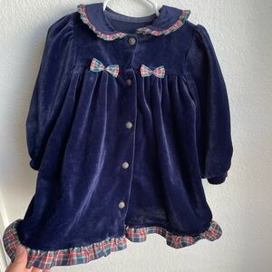 Heirloom navy velvet dress with plaid accents, made in UK.